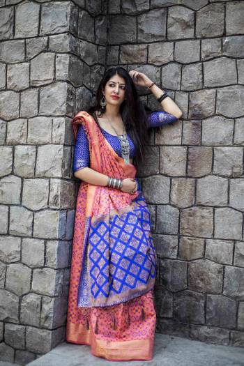 Look Pretty In this Pink Colored Saree Paired With Contrasting Royal Blue Colored Blouse. This Saree And Blouse Are Fabricated On Jacquard Silk Beautified With Weave All Over It. Its Lovely Combination Will Earn You Lots Of Compliments From Onlookers.