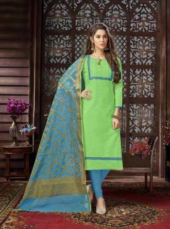 Pretty Simple Dress Material Is Here In Light Green Colored Top Paired With Contrasting Turquoise Blue Colored Bottom And Dupatta. Its Top Is Fabricated On Cotton Silk Paired With Cotton Bottom And Banarasi Jacquard Dupatta. Get This Stitched As Per Your Desired Fit And Comfort. 