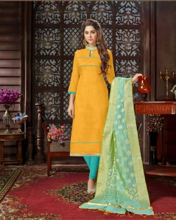 Get Ready For The Upcoming Festive Season And Enjoy With Beauty And Comfort Wearing This Straight Cut Suit In Yellow Colored Top Paired With Contrasting Sea Green Colored Bottom And Dupatta. This Dress Material Is Fabricated On Cotton Silk Paired With Cotton Bottom and Banarasi Jacquard Dupatta. Get This Stitched As Per Your Desired Fit And Comfort.