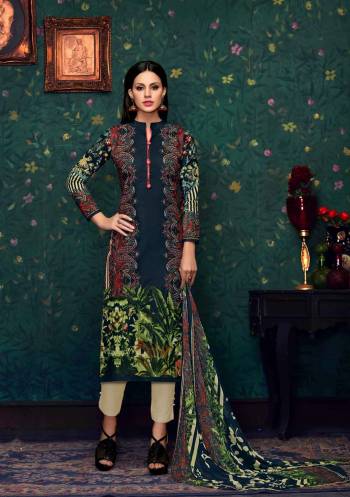 Enhance Your Personality Wearing this Straight Cut Suit In Navy Blue Color Paired With Cream Colored Bottom And Multi Colored Dupatta. Its Top And Bottom Are Fabricated On Cotton Paired With Chiffon Dupatta. It Has Floral Primts All Over Its Top And Dupatta. Buy It Soon Before The Stock Ends.