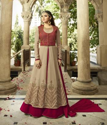 Here Is A Beautiful Designer Floor Length Suit In Beige And Maroon Color Paired With Maroon Colored Bottom And Dupatta. Its Top Is Fabricated On Georgette Paired With Santoon Bottom And Chiffon Dupatta. This Suit Has Indo-Western look Which Will Earn You Lots Of Compliments From Onlookers.