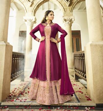 Another Jacket Patterned Designer Floor Length Suit In Baby Pink And Wine Color Paired With Baby Pink Colored Bottom And Wine Colored Dupatta. Its Top Is Fabricated On Georgette Paired With Santoon Bottom And Chiffon Dupatta. It Has Beautiful Embroidery Over The Suit And Jacket. Its Lovely Combination Will Earn You Lots Of Compliments From Onlookers.  