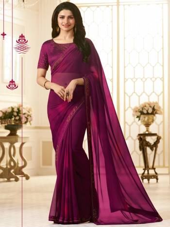 You Will Definitely Earn Lots Of Compliments Wearing This Beautiful Shade Saree In Wine Color Paired With Wine Colored Blouse. This Saree Is Fabricated On Georgette Paired With Art Silk Fabricated Blouse. It Is Beautified With Stone Work Over The Blouse And Saree Lace Border. 