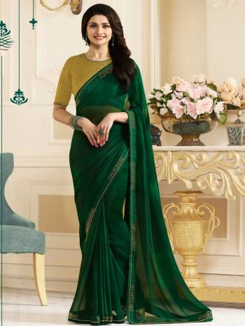 Dark Colors Always Makes You Look More Attractive And Beautiful, So Grab This Saree In Dark Green Color Paired With Pear Green Colored Blouse. This Saree Is Fabricated On Georgette Paired With Art Silk Fabricated Blouse. Its Fabrics Are Soft Towards Skin And Easy To Carry Throughout The Gala. Buy Now.