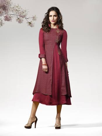 Here Is A Pretty Rich Looking Kurti In Maroon Color Fabricated On Crepe Silk Beautified With Prints And Patch Work. It Has Pretty Double Layered Pattern Which Makes You Look The Prettiest Of All.