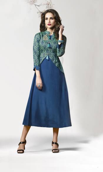 Kurtis Always Gives A Trendy And Pretty Look, Grab This Lovely Readymade Kurti In Blue Color Fabricated On Crepe Silk Beautified With Prints and Patch Work. It IS Soft Towards Skin And Easy To Carry All Day Long.