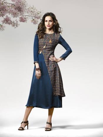 Kurtis Always Gives A Trendy And Pretty Look, Grab This Lovely Readymade Kurti In Blue Color Fabricated On Crepe Silk Beautified With Prints and Patch Work. It IS Soft Towards Skin And Easy To Carry All Day Long.