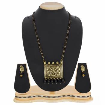 Here Is A Beautiful, Traditonal And Heavy Looking Magalsutra Is Here Paired With Matching Earrings. This Magalsutra Is For Occasion Wear That Can Be Paired With Any Traditional Attire. Buy Now.