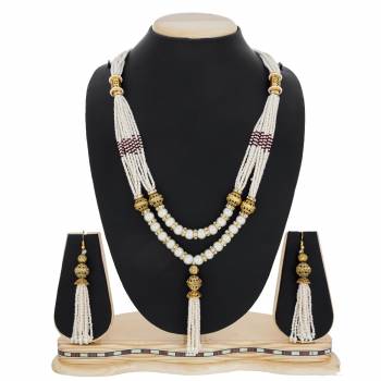 Here Is A Beautiful Queen Necklace Set In Golden And White Color Beautified with Stone and Moti Work. This Necklace Set Can Be Paired With Silk Saree Or Straigth Suit For A Beautiful Look. Buy Now.