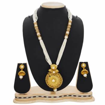 Here Is A Beautiful Queen Necklace Set In Golden And White Color Beautified with Stone and Moti Work. This Necklace Set Can Be Paired With Silk Saree Or Straigth Suit For A Beautiful Look. Buy Now.