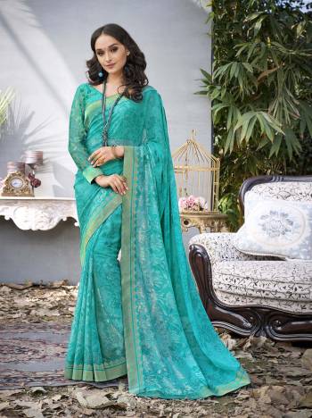 Add This Lovely Shade Of Blue With This Saree In Turquoise Blue Color Paired With Turquoise Blue Colored Blouse, This Saree Is Fabricated On Georgette Paired With Two Blouses, One Is Fabricated On Art Silk And Another On Jacquard Net. All Three Fabircs Ensures Superb Comfort All Day Long. Buy Now. 