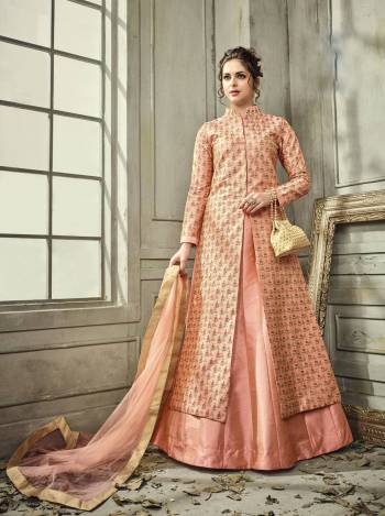 Most Demanding And Running Color Of The Season Is Here With This Readymade Indo-Western Suit In Peach Colored Top Paired With Peach Colored Lehenga And Dupatta. Its Top And Bottom Are Fabricated On Satin Silk Paired With Net Fabricated Dupatta. It Has Beautiful Embroidery All Over Its Top. Buy Now.