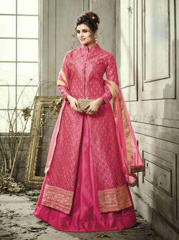 Shine Bright Wearing This Indo-Western Suit In Dark Pink Color Paired With Dark Pink Colored Bottom And Dupatta. Its Top Is Fabricated On Satin Silk Paired With Satin Silk Lehenga And Net Dupatta. This Suit Is Suitable For Any Wedding, Festive Or Social Function. Buy Now.