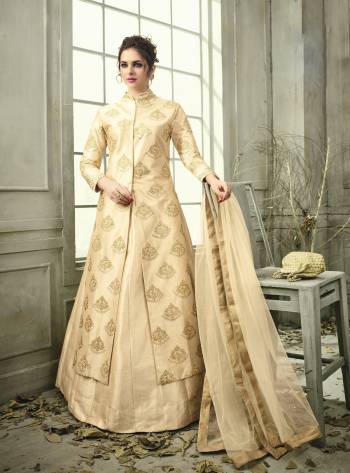 Flaunt Your Rich And Elegant Taste Wearing This Designer Indo-Western Suit In Beige Colored Top Paired With Beige Colored Bottom And Dupatta. Its Top Is Fabricated On Satin Silk Paired With Satin Silk Lehenga And Net Dupatta. This Readymade Suit Enusres Superb Comfort Throughout The Gala.