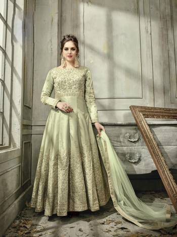 Add This Lovely Shade Of Green To Your Wardrobe With This Beautiful Designer Floor Length suit In Mint Green Colored Paired With Mint Green Colored Bottom And Dupatta. Its Top Is Fabicated On Satin Silk Paired With Santoon Bottom And Net Dupatta. Buy This Readymade Suit Now.