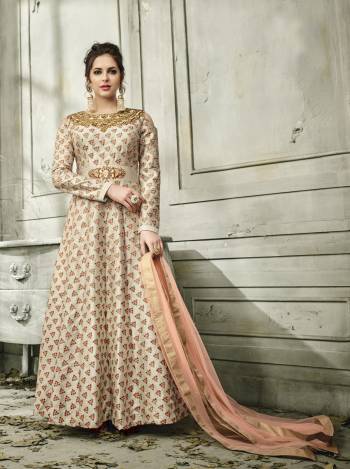 Earn Lots Of Compliments Wearing This Designer Floor Length Suit In Beige Colored Top Paired With Beige Colored Bottom And Contrasting Peach Colored Dupatta. Its Top Is Fabricated On Satin Silk Paired With Santoon Bottom And Net Dupatta. Its All Three Fabrics Ensures Superb Comfort All Day Long. Buy Now.