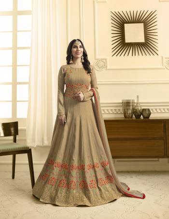 Flaunt Your Rich And Elegant Taste Wearing This Subtle Shade Of Beige Colored Designer Floor Length Suit Paired With Beige Colored Bottom And Dupatta. Its Top Is Fabricated On Art Silk Piared With Santoon Bottom And Chiffon Dupatta. It Also Ensures Superb Comfort All Day Long. Buy Now.