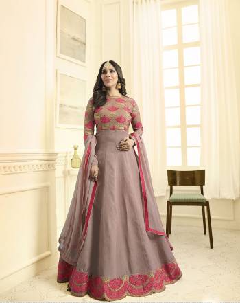 Add This New And Unique Shade To Your Wardrobe With This Designer Floor Length Suit In Mauve Colored Top Paired With Mauve Colored Bottom And Dupatta. This Beautiful Shade Of Purple Will Earn You Lots Of Compliments From Onlookers. Its Top Is Fabricated On Art Silk Paired With Santoon Bottom And Chiffon Dupatta. Buy Now.