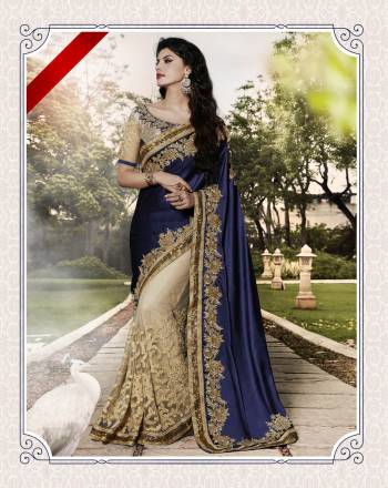 Earn Lots Of Compliments Wearing This Beautiful Designer Saree In Navy Blue And Cream Color Paired With Cream Colored Blouse. This Saree Is Fabricated On Satin Cotton And Net Paired With Art Silk And Brocade Fabricated Blouse. Its Attractive Embroidery And Color  Will Make You Earn Lots Of Compliments From Onlookers.