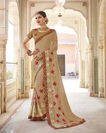 Flaunt Your Rich And Elegant Taste Wearing This Saree In Beige Color Paired With Beige Colored Blouse. This Saree Is Fabricated On Georgette Paired With Art Silk Fabricated Blouse. It Is Beautified With Contrasting Red colored Embroidered Motifs. Buy It Now.