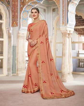 Most Demanding Color Of The Season Is Here With This Pretty Peach Colored Saree Paired With Peach Colored Blouse. This Saree Is Fabricated On Silk Georgette Paired With Art Silk Fabricated Blouse. It Is Beautified With Embroidered Motifs And Lace Border. Buy This Designer Saree Now.