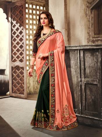 Here Is A Beautiful Combination With This Designer Saree In Peach And Pine Green Color Paired With Brown Colored Blouse. This Saree Is Fabricated On Art Silk And Georgette Paired With Art Silk Fabricated Blouse. It Has Attractive Embroidered Lace Border. This Saree Will Give A Rich Look To Your Personality. Buy Now.