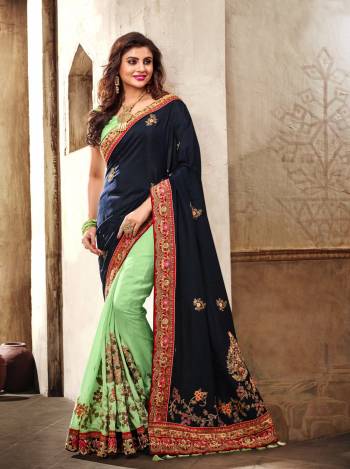 Get Ready For The Next Social Function At Your Place With This Designer Saree In Navy Blue And Pastel Green Color Paired With Pastel Green Colored Blouse. This Saree Is Fabricated On Georgette And Art Silk Paired With Art Silk Fabricated Blouse. It Has Contrasting Embroidery Over The Saree Making It More Attractive.