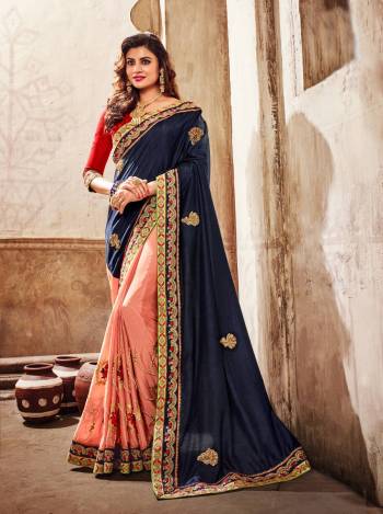 Go Colorful Wearing This Designer Saree In Navy Blue And Peach Color Paired With Contrasting Red Colored Blouse. This Saree Is Fabricated On Art Silk Paired With Art Silk Fabricated Blouse. This Designer Saree IS Suitable For Any Occasion, Be It A Function Or Festive Or A Wedding.