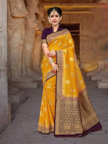 Celebrate This Festive Season Wearing This Attractive Saree In Yellow Color Paired With Contrasting Wine Colored Blouse. This Saree And Blouse Are Fabricated On Art Silk Beautified With Weave. This Attractive Silk Based Saree Will Give You A Rich Look Like Never Before.