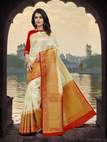 Simple And Elegant Looking Saree Is Here In White Color Paired With Red Colored Blouse. This Saree And Blouse Are Fabricated On Art Silk Beautified With Weave All Over It. Buy This Saree Now.