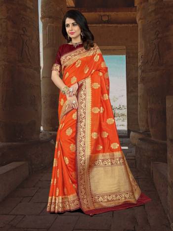 Shine Bright Wearing This Silk Saree In Orange Color Paired With Contrasting Maroon Colored Blouse. This Saree And Blouse Are Fabricated On Art Silk Beautified With Weave All Over It. This Saree Is Easy To Drape And Also Durable.