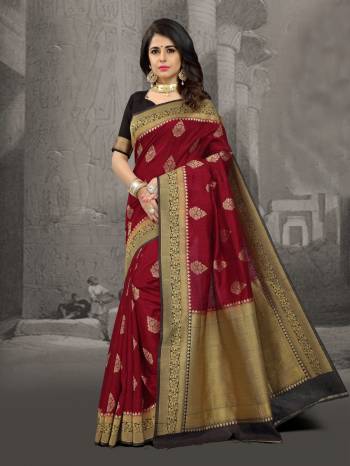 For A Queen Like Look, Grab This Saree In Maroon Color Paired With Black Colored Blouse. This Saree Is Beautified With Weave All Over It. Also It Will Give You An Attractive Personality Like Never Before.