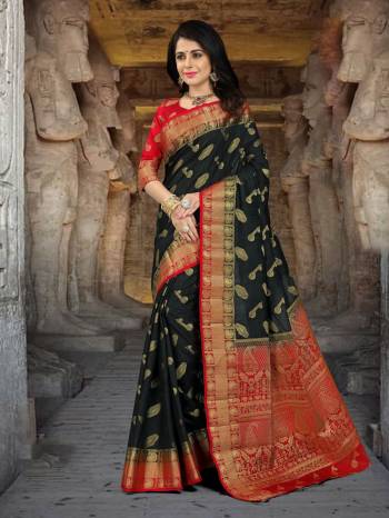 Enhance Your Beauty Wearing This Saree In Black Color Paired With Red Colored Blouse. This Saree And Blouse Are Fabricated On Art Silk Beautified With Weave All Over It. It Is Light Weight And Easy To Carry All day Long.