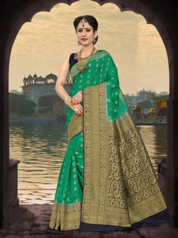 Very Pretty Shade Of Green Is Here With This Saree In Sea Green Color Paired With Black Colored Blouse. This Saree And Blouse are Fabricated On Art Silk Beautified With Weave All Over It. Buy This Saree Now.