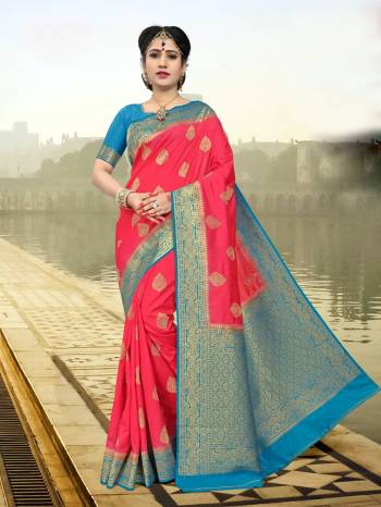 Grab This Pretty Saree In Pink Color Paired With Contrasting Turquoise Blue Colored Blouse. This Saree And Blouse Are Fabricated On Art Silk Beautified With Weave All Over. Buy This sAree Now.