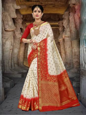 Simple And Elegant Looking Saree Is Here In White Color Paired With Red Colored Blouse. This Saree And Blouse Are Fabricated On Art Silk Beautified With Weave All Over It. Buy This Saree Now.