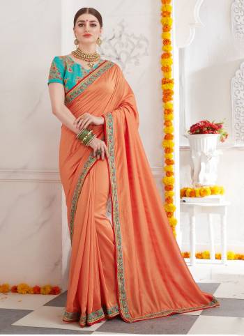 A Must Have Color In Every Women's Wardrobe Is  Here With This Designer Peach Colored Saree Paired With Contrasting Sky Blue Colored Blouse. This Saree Is Fabricated On Soft Silk Paired With Art Silk Fabricated Blouse, It Has Attractive Embroidery Over The Blouse And Lace Border. Buy Now.