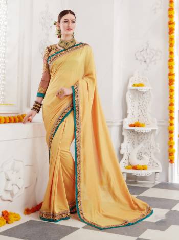 Celebrate This Festive Season Wearing This Designer Saree In Yellow Color Paired With Contrasting Brown Colored Blouse, This Saree Is Fabricated On Soft Silk Paired With Art Silk Fabricated Blouse. Also It Will Give Your Personality A Rich Look Like Never Before.