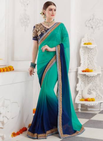 Shades Of Blue Gives A Cool And Fresh Look Everytime You Wear It, Grab This Designer Saree In Shaded Blue Colors Paired With Navy Blue Colored Blouse. This Saree Is Fabricated On Georgette Paired With Art Silk And Net Fabricated Blouse. It Is Light Weight, Easy To Drape And Carry All Day Long. 