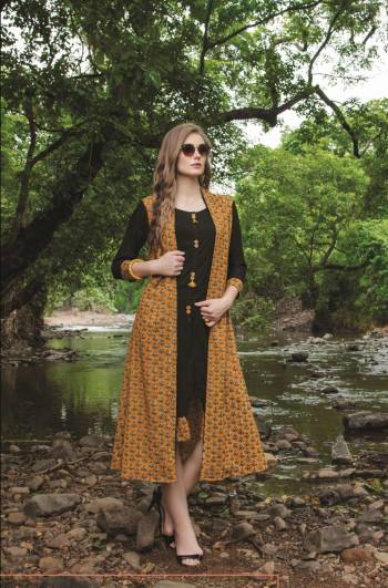 Grab This Jacket Patterned Readymade Kurti In Black And Yellow Color Fabricated On Cotton Beautified With Prints. This Kurti Is Available In Many Sizes And Ensures Superb Comfort all Day Long.