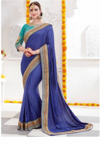 Go With This Shades Of Blue With This Saree In Blue Color Paired With Turquoise Blue Colored Blouse. This Saree Is Fabricated On Satin Silk Paired with Art Silk Fabricated Blouse. It Has Embroidery Over The Blouse and Saree Lace Border. Buy This Designer Saree Now.