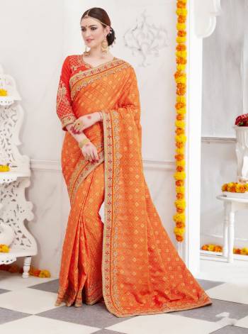 Orange And Red Color Induces Perfect Summery Appeal To Any Outfit So Grab This Designer Saree In Orange Color Paired With Contrasting Red Colored Blouse. This Saree Is Fabricated On Satin Silk Paired With Art Silk Fabricated Blouse. It Is Light Weight And Easy To Drape And Easy To Care For.