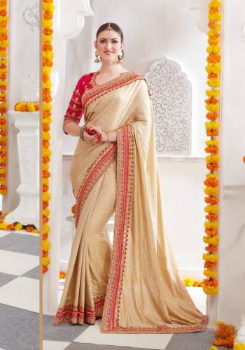 Simple And Elegant Looking Designer Saree Is Here In Beige Color Paired With Contrasting Red Colored Blouse. This Saree Is Fabricated On Satin Silk Paired With Art Silk Fabricated Blouse. It Has Beautiful Embroidered Lace Border And Blouse. Buy Now. 