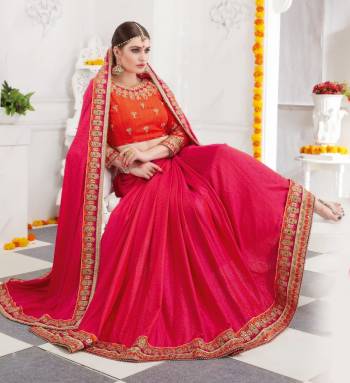 Shine Bright Wearing This Designer Dark Pink Colored Saree Paired With Contrasting Orange Colored Blouse. This Saree Is Fabricated On Satin Silk Paired With Art Silk Fabricated Blouse.  It Is Beautified With Jari Embroidery Giving The Saree Quite Heavy Look.