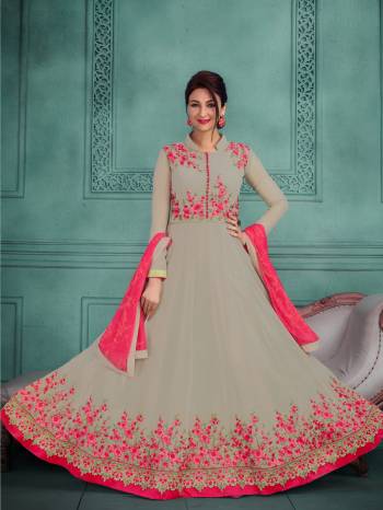 You Will Definitely Earn Lots Of Compliments Wearing This Designer Floor Length Suit In Grey Colored Top Paired With Grey Colored Bottom And Dark Pink Colored Dupatta. Its Top Is Fabricated On Georgette Paired With Santoon Bottom And Chiffon Dupatta. It Has Attractive Embroidery Over the Yoke And Suit Panel.