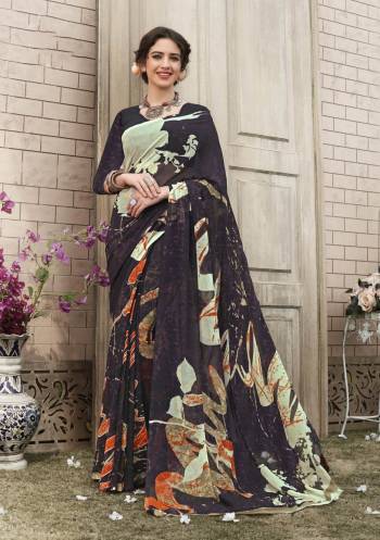 For Your Casual Wear, Grab This Pretty Saree In Darkest Shade Of Wine Paired With Wine Colored Blouse, This Saree And Blouse Are Fabricated On Georgette Beautified With Bold Abstract Prints. 