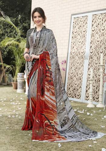 Add This Saree To Your Wardrobe In Grey Color Paired With Grey Colored Blouse. This Saree And Blouse Are Fabricated On Georgette Beautified With Prints All Over It. Buy This Saree Now.