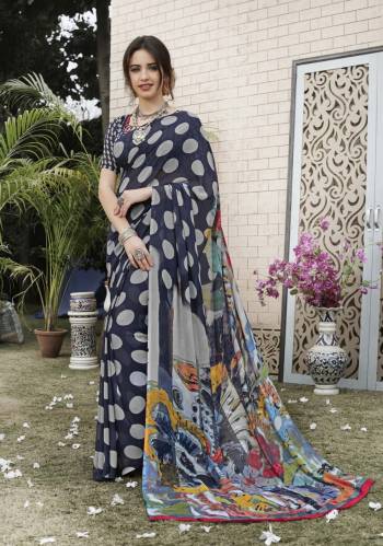 Dark Colors Always Gives An Attractive Look To Your Personality, So Grab This Saree In Dark Blue Color Paired With Dark Blue Colored Blouse. This Saree And blouse are fabricated On Georgette Beautified With Polka Dots Abstract Prints. Buy Now.