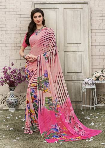 Look Pretty And Earn Lots Of Compliments Wearing This Saree In Baby Pink Color Paired With Pink Colored Blouse. This Saree And Blouse Are Fabricated On Georgette Beautified With Multi Colored Floral Prints.