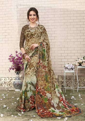 All Color Is Always The Best Color So Grab This Multi colored Saree Paired With Light Brown Colored Blouse. This Saree And Blouse Are Fabricated On Georgette Beautified With Prints All Over It. Buy This Saree Now.